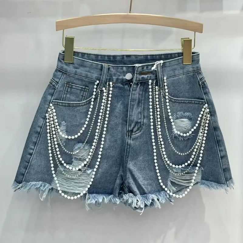 Shorts jeans con catene di perle Pearl Unchain stile western chic