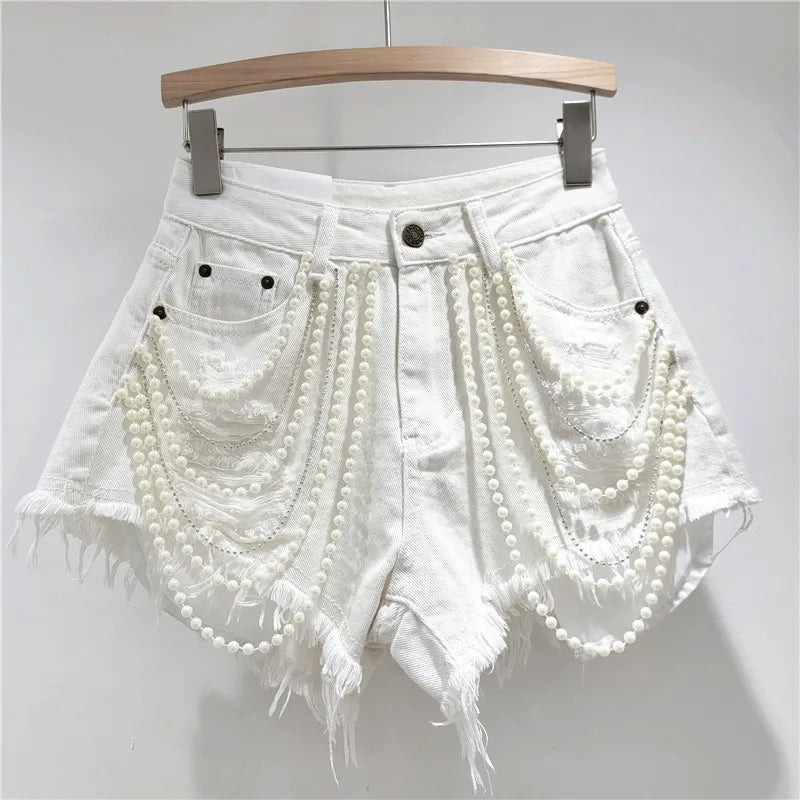 Shorts jeans con catene di perle Pearl Unchain stile western chic