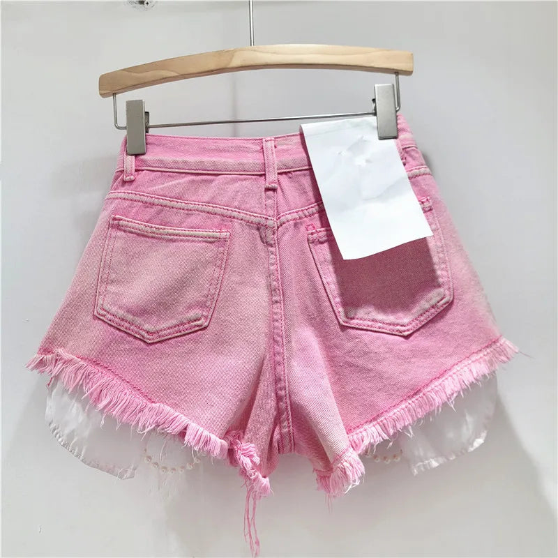 Shorts jeans con catene di perle Pearl Unchain stile western chic