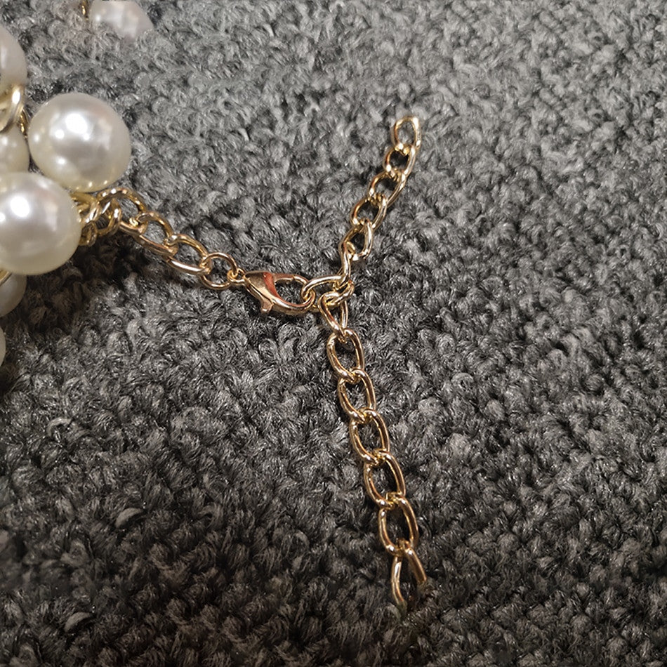 Top-scultura in perle Nyhg