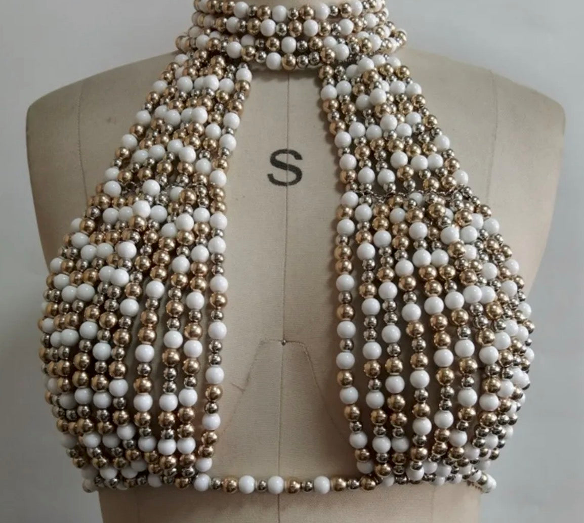 Top gioiello Oresha con perle decorative e design halter