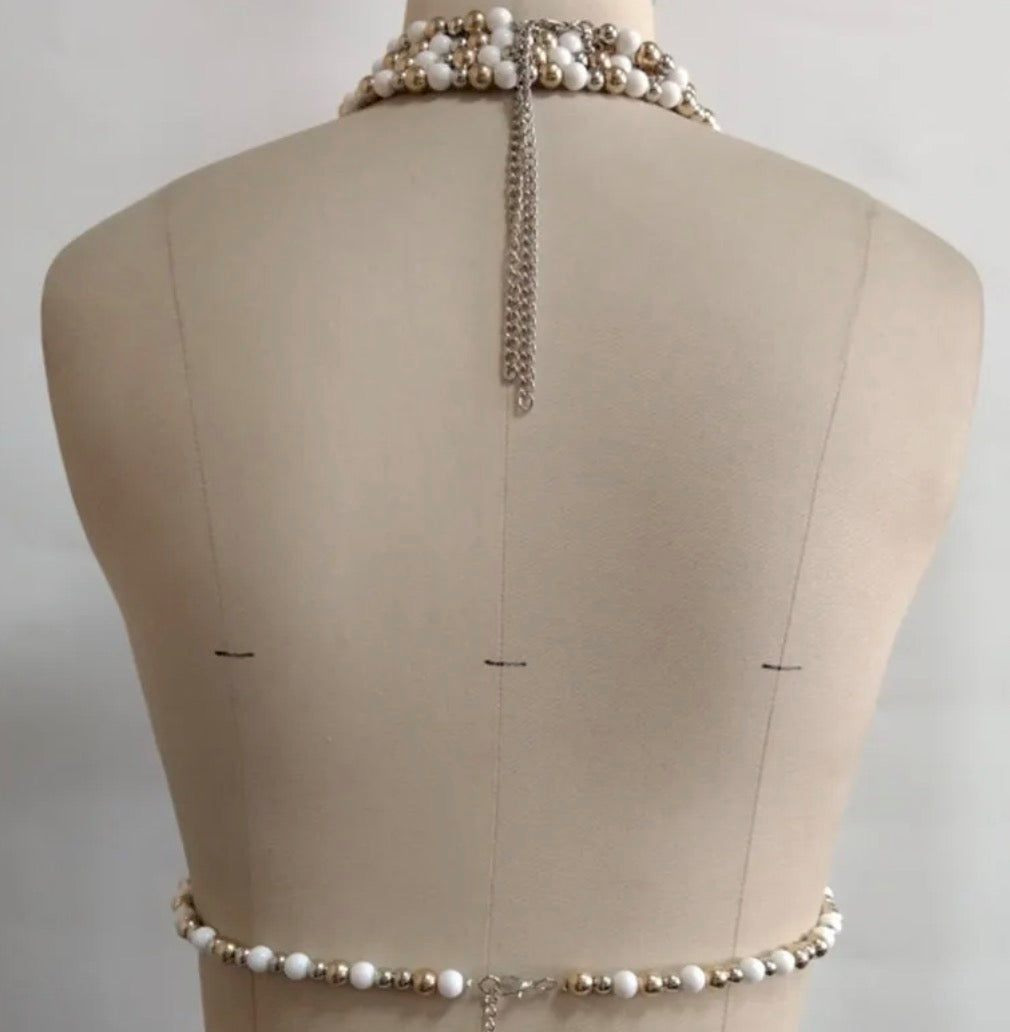 Top gioiello Oresha con perle decorative e design halter