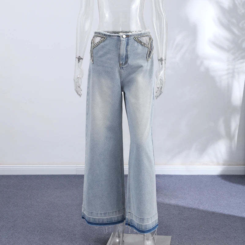 Jeans stella strass fianco nude
Gamba larga cut-out orlo grezzo