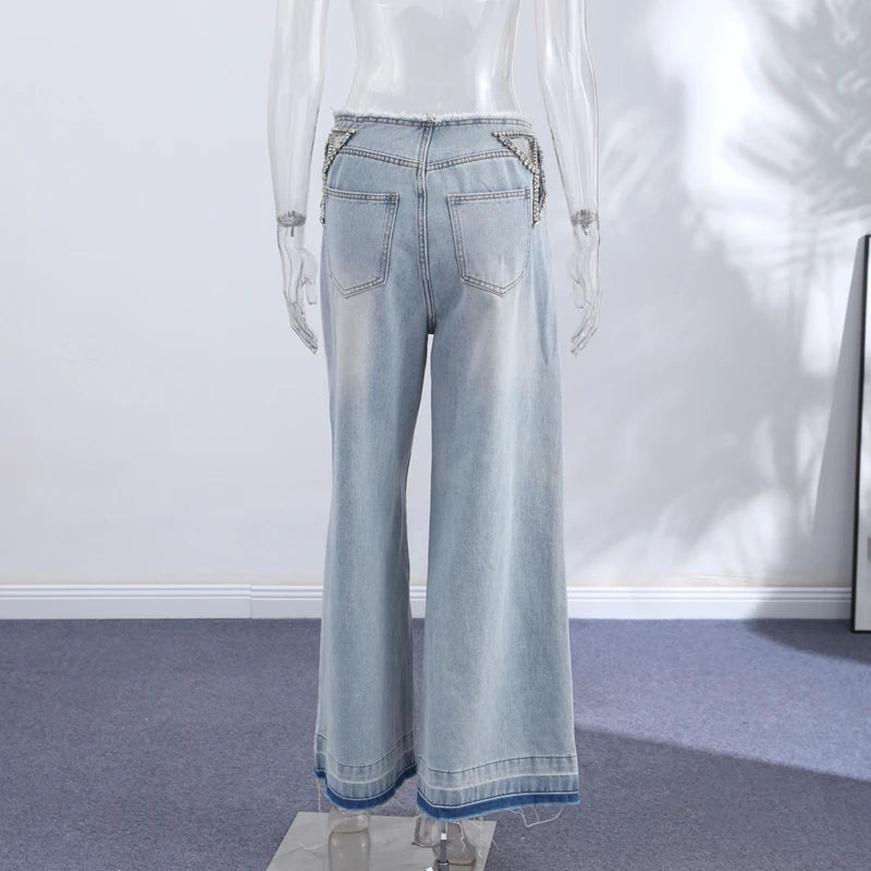 Jeans stella strass fianco nude
Gamba larga cut-out orlo grezzo