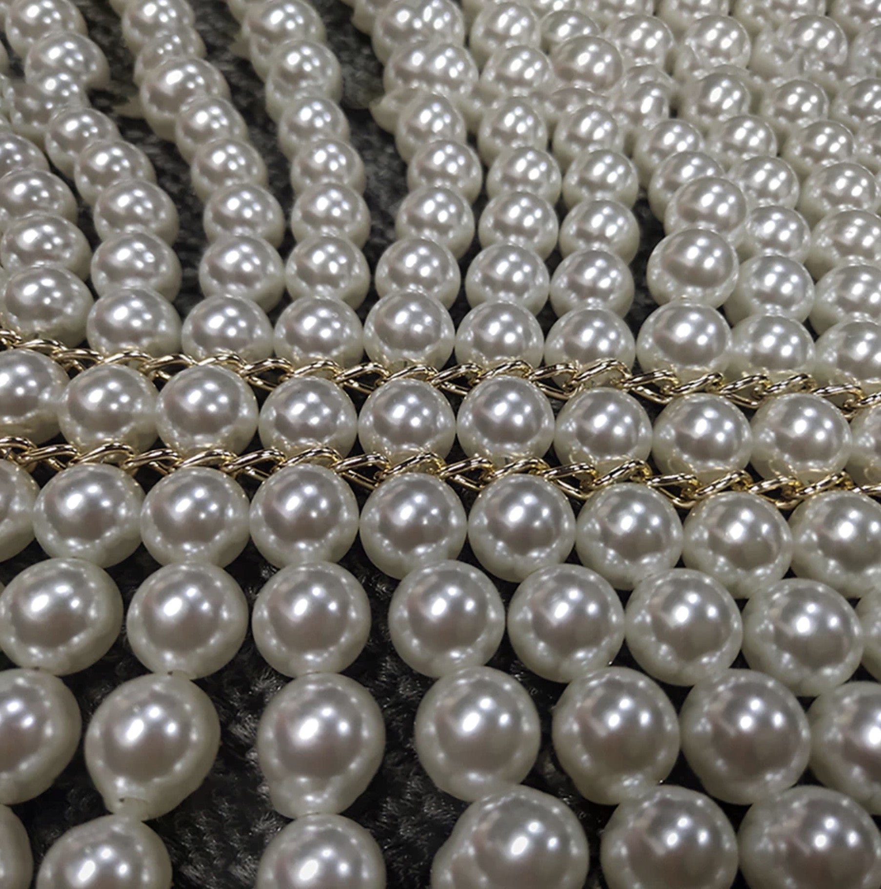 Top-scultura in perle Nyhg