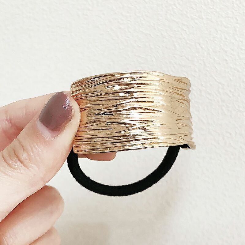 Copri-coda elastico metal