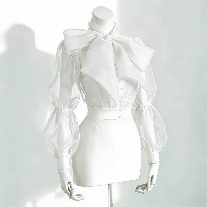 Camicia in tulle trasparente con fiocco e maniche a palloncino Gildga – Nera