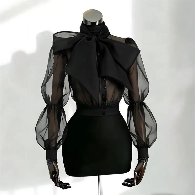 Camicia in tulle trasparente con fiocco e maniche a palloncino Gildga – Nera