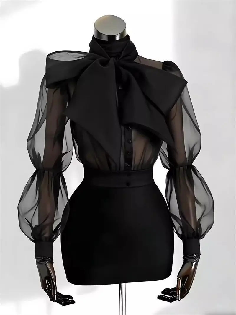 Camicia in tulle trasparente con fiocco e maniche a palloncino Gildga – Nera