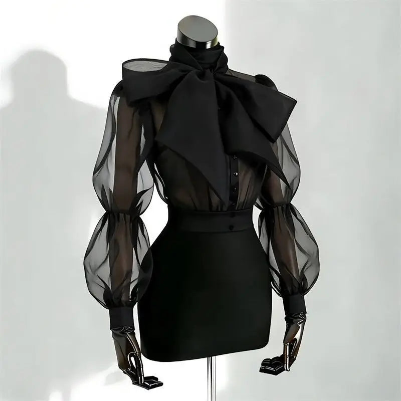 Camicia in tulle trasparente con fiocco e maniche a palloncino Gildga – Nera