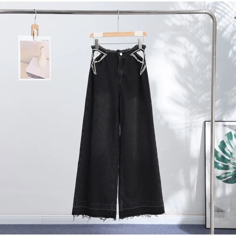 Jeans stella strass neri appesi vista frontale | Dream Shop