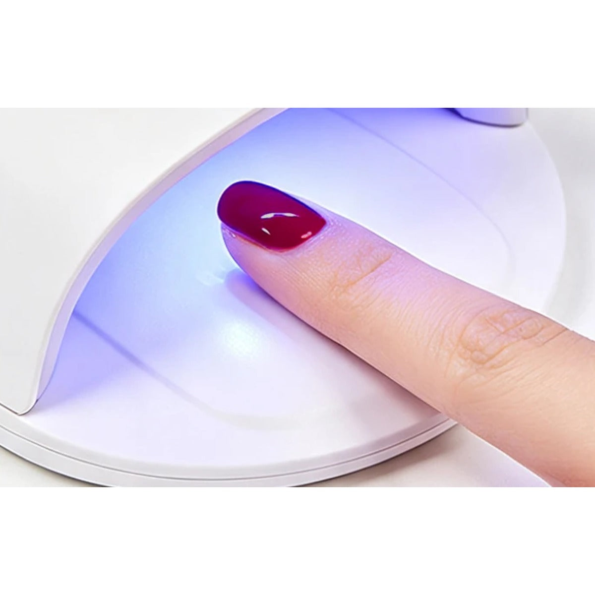 Gel nail polish pen curing under the UV LED lamp for 60 seconds | Dream Shop